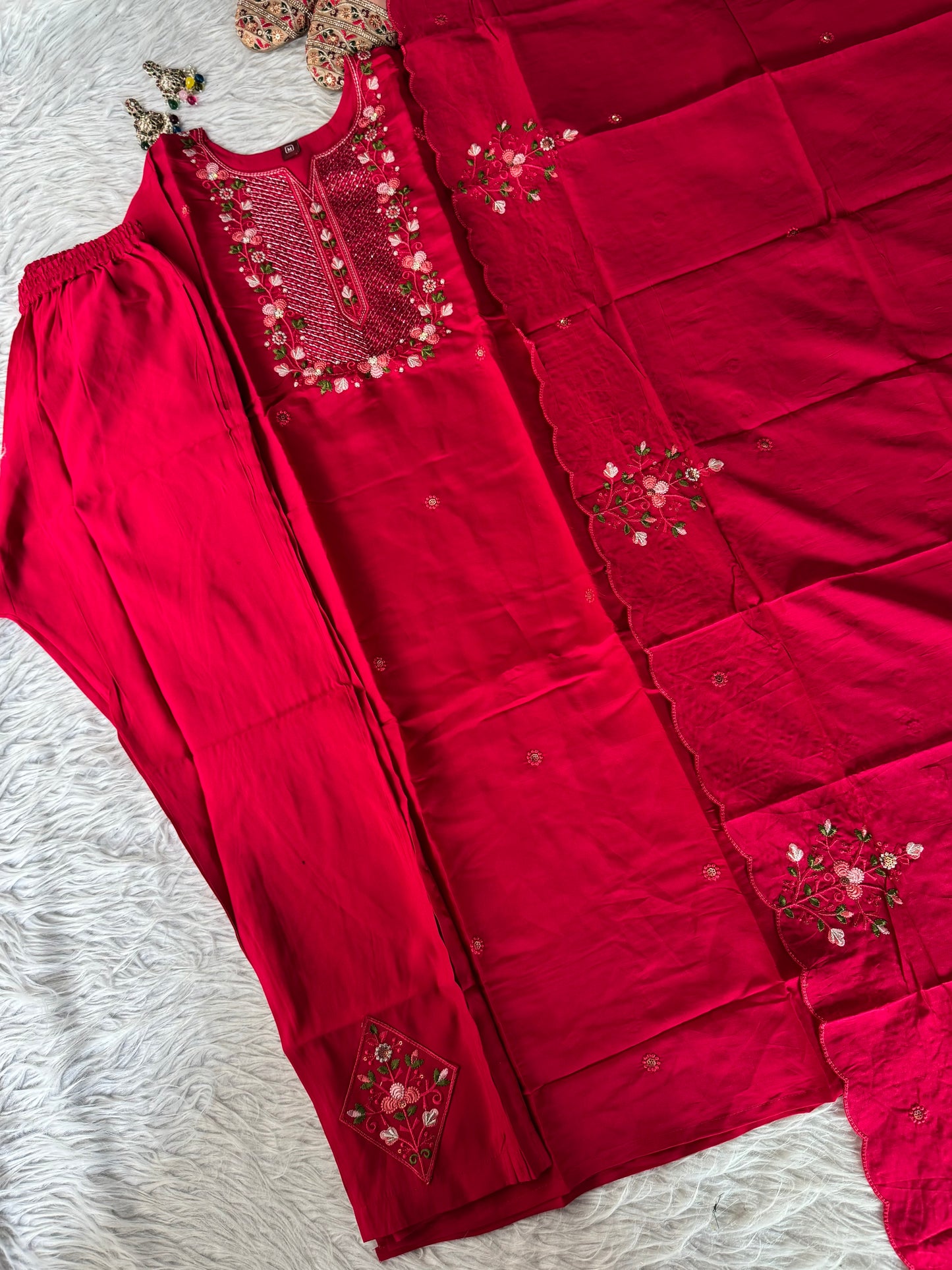 MD-203
"Royal elegance in every stitch – deep plum adorned with delicate floral embroidery for a timeless festive charm."