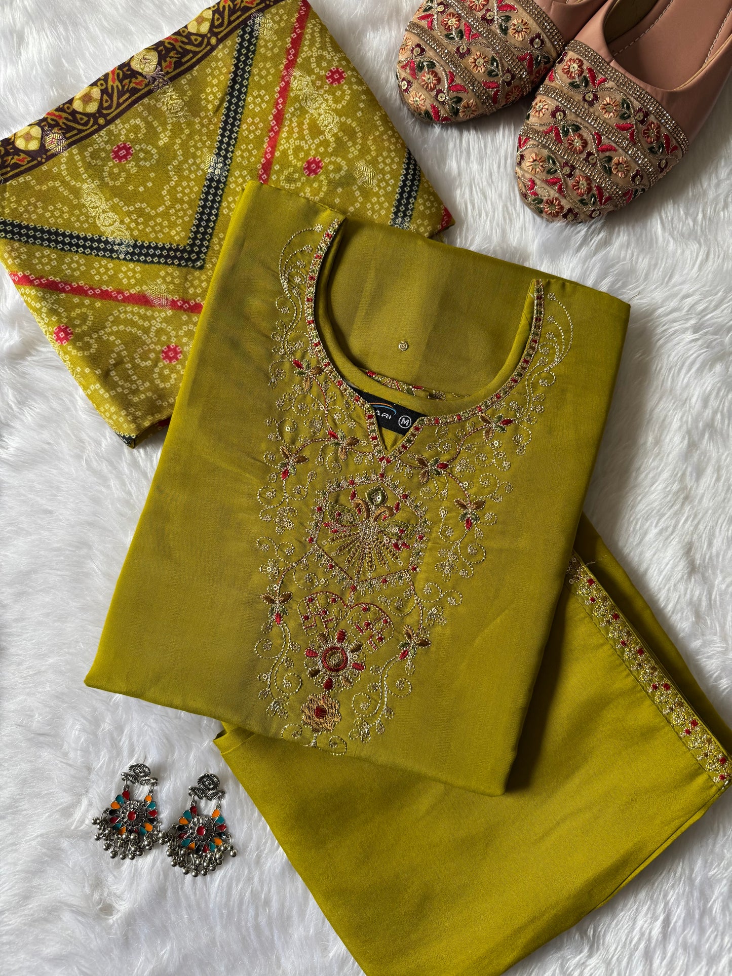 MD-187 this mustard green suit set features intricate neckline embroidery paired with a rich Banarasi dupatta, making it an exquisite choice for festive occasions and celebrations. ✨💛