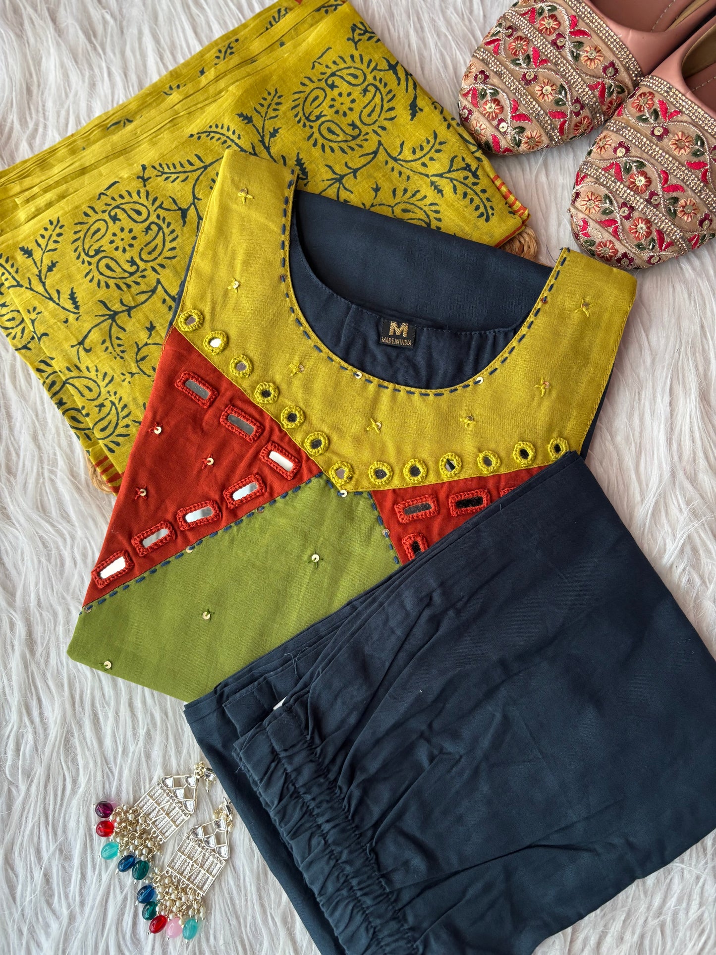 MD-229 That is a beautiful ethnic set! Here are a few caption options for your article or social media post, ranging from elegant to trendy: