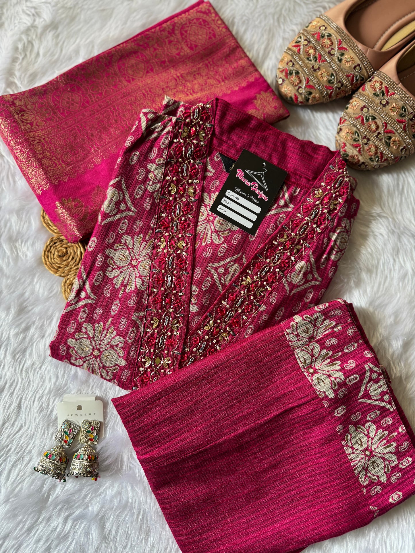 MD-171 "Regal Rose Banarasi Ensemble"

This elegant design features a rich magenta kurta adorned with intricate golden motifs, paired with a matching pleated bottom and a luxurious silk dupatta — perfect for festive elegance and timeless tradition.