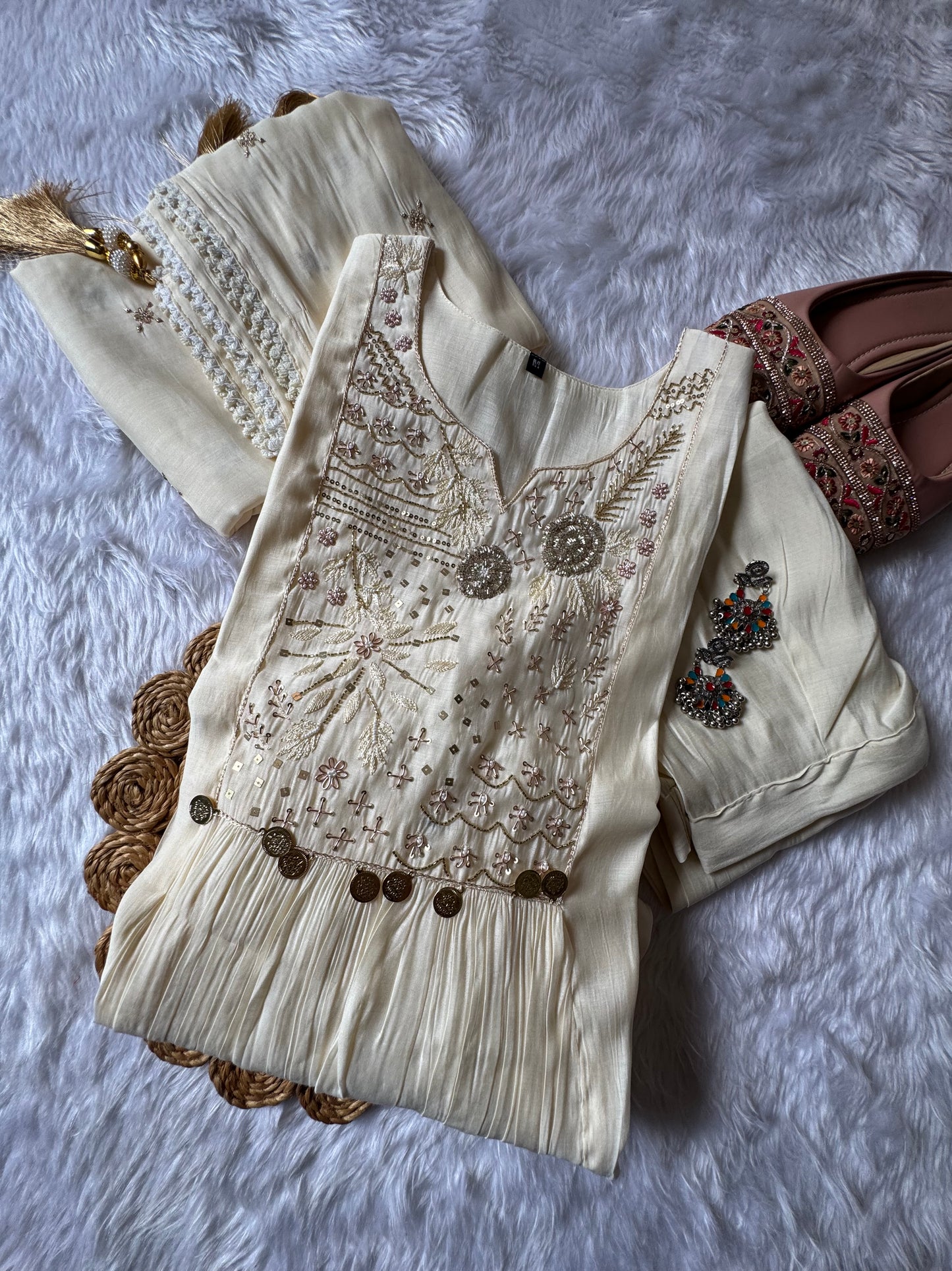 MD-184 This elegant suit set features delicate thread embroidery and mirror accents, paired with a soft, flowy dupatta — perfect for timeless festive charm.