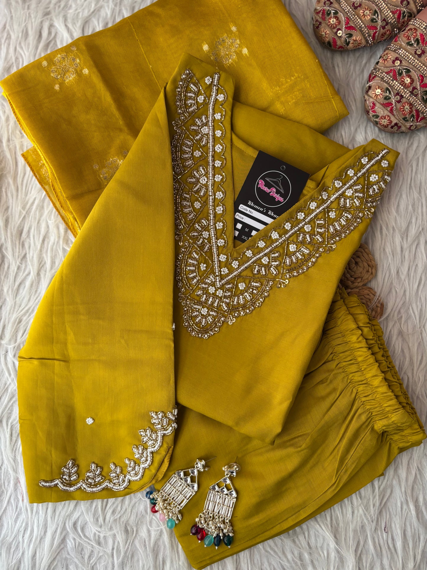 MD-263 The mauve hue of this ethnic set is absolutely stunning! The intricate embroidery on the neckline and sleeves gives it such a sophisticated look. Here are a few caption options for your post, ranging from elegant to more casual