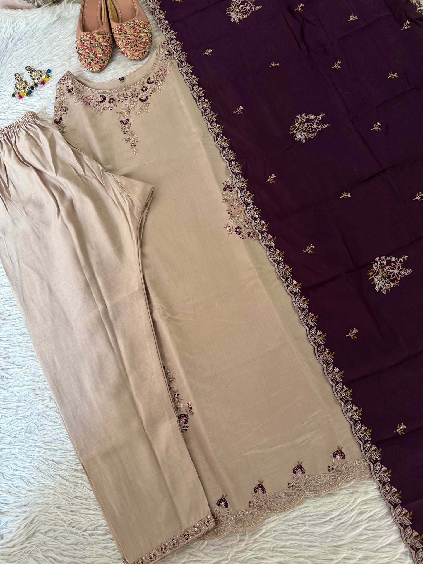MD-214 Royal elegance in every stitch – deep plum adorned with delicate floral embroidery for a timeless festive charm."