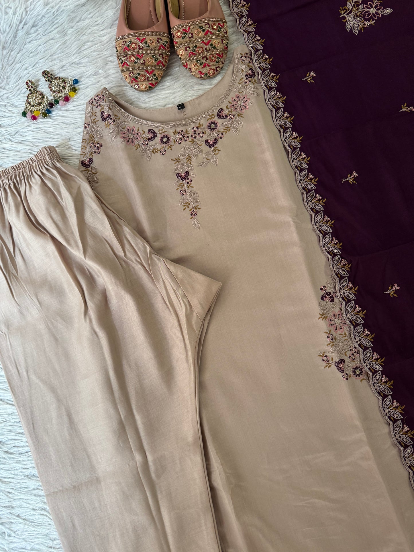 MD-214 Royal elegance in every stitch – deep plum adorned with delicate floral embroidery for a timeless festive charm."