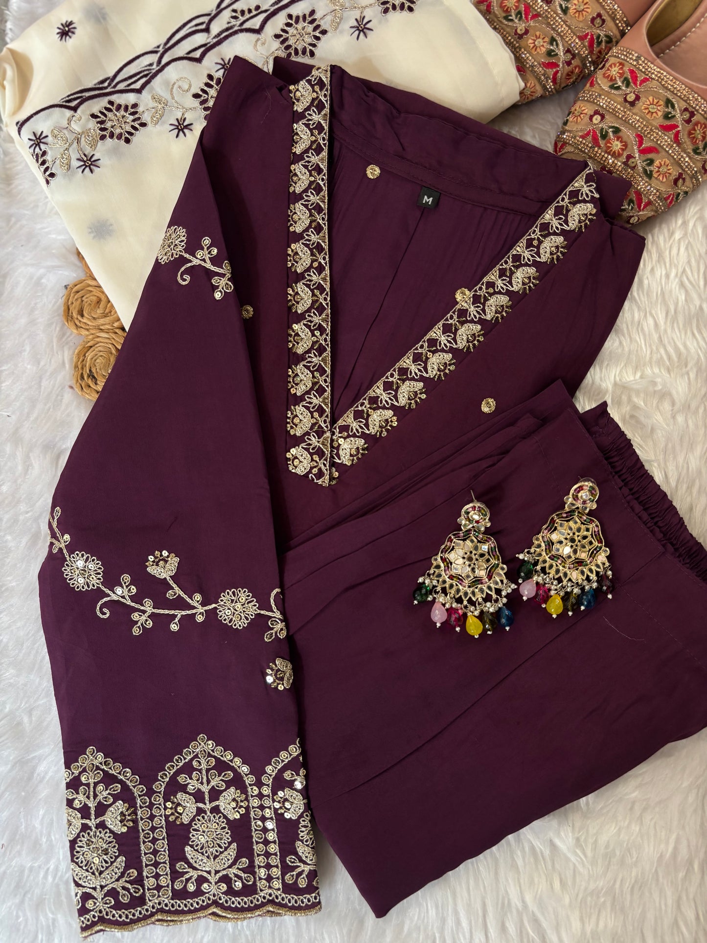 MD-213 "Elegance in every detail with embroidary work ✨ This deep purple suit with delicate floral embroidery is a perfect blend of grace and tradition