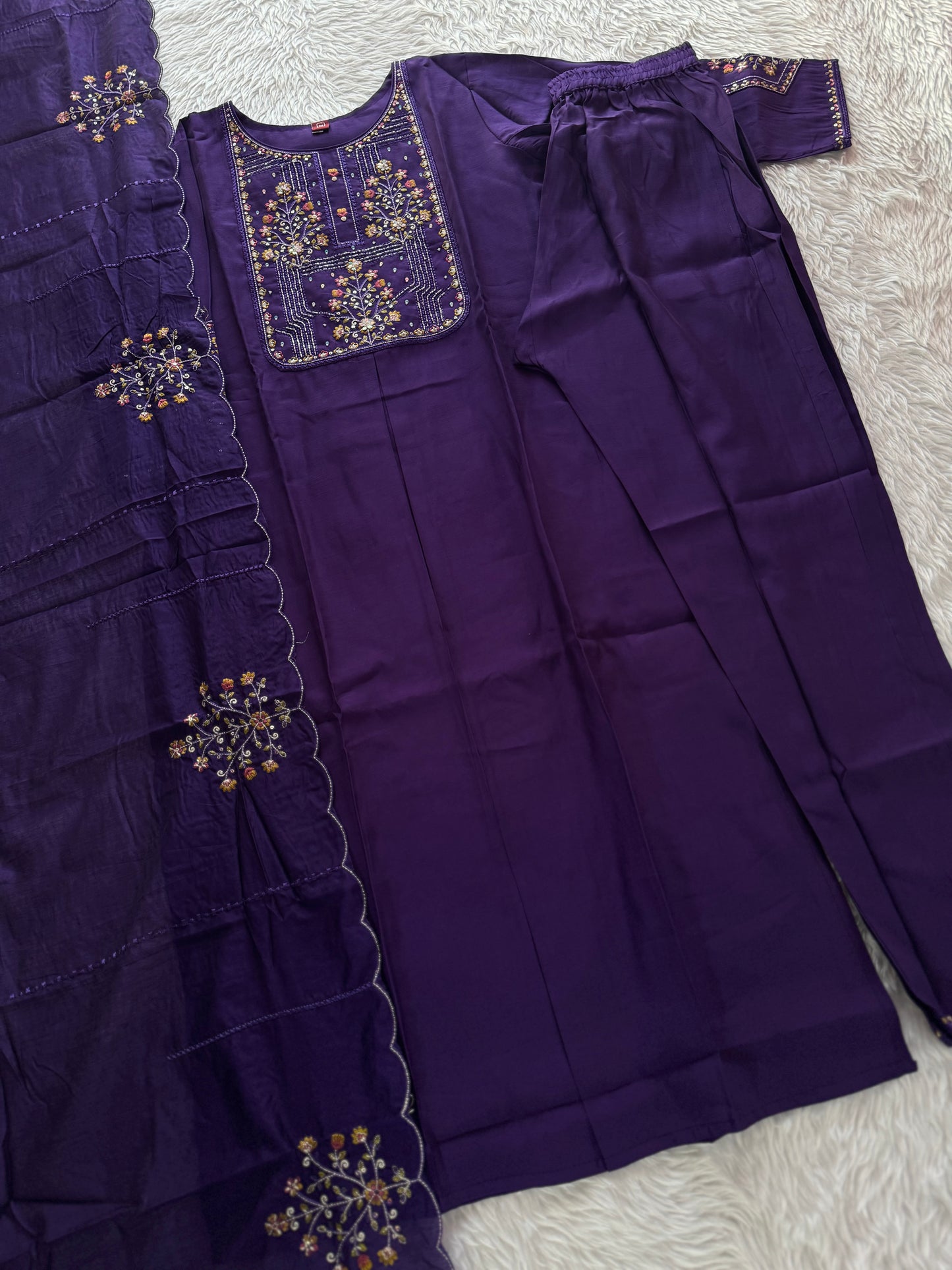 MD-211 hend work new designs in 3 piece MD-209 "Elegance in every detail ✨ This deep purple suit with delicate floral embroidery is a perfect blend of grace and tradition 🌸💜