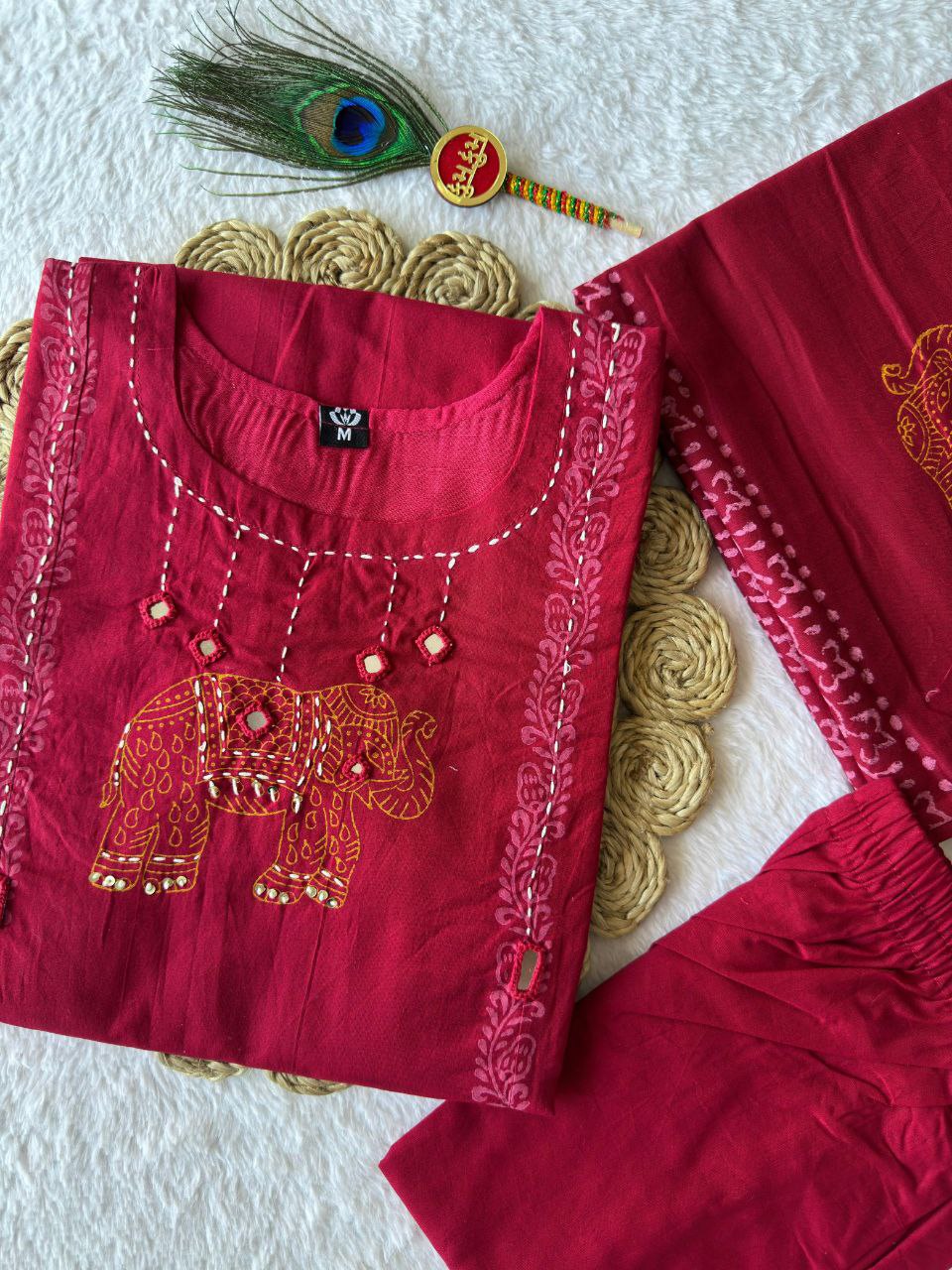 MD-237 Choosing the right title depends on the vibe of your brand, but since this piece features traditional elephant embroidery and a rich crimson hue, you can play with themes of heritage, royalty, and grace❤️💥💫