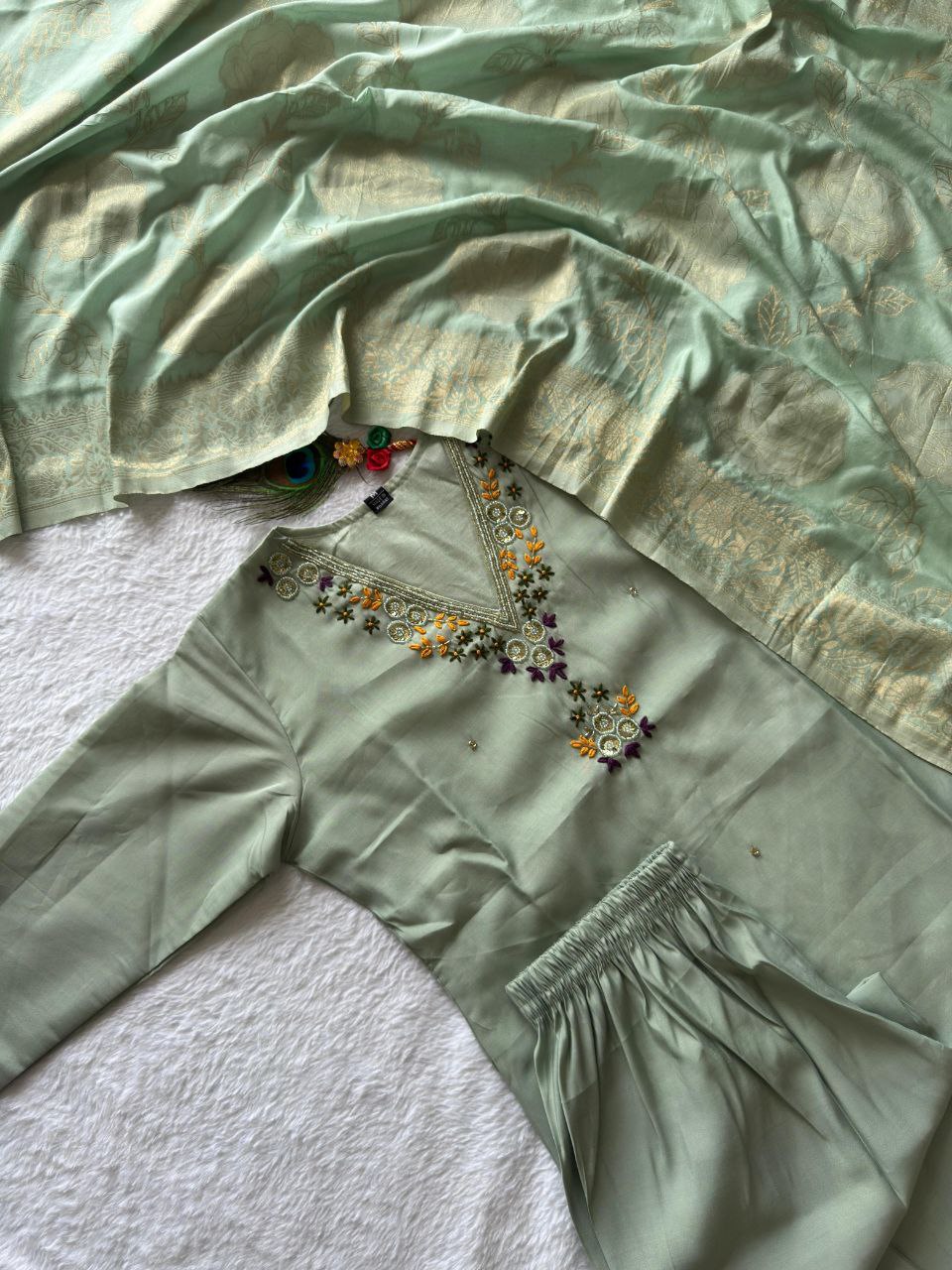 MD-239This sage green ensemble has a lovely, calming aesthetic. The V-neck embroidery and the peacock feather accent suggest a perfect blend of traditional craft and modern elegance.💜💥💫