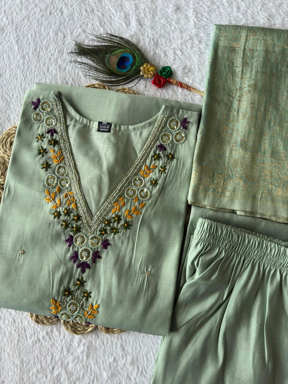 MD-239This sage green ensemble has a lovely, calming aesthetic. The V-neck embroidery and the peacock feather accent suggest a perfect blend of traditional craft and modern elegance.💜💥💫
