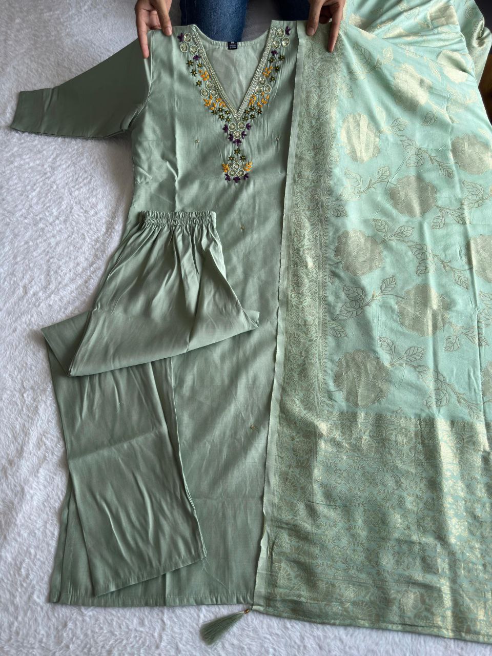 MD-239This sage green ensemble has a lovely, calming aesthetic. The V-neck embroidery and the peacock feather accent suggest a perfect blend of traditional craft and modern elegance.💜💥💫